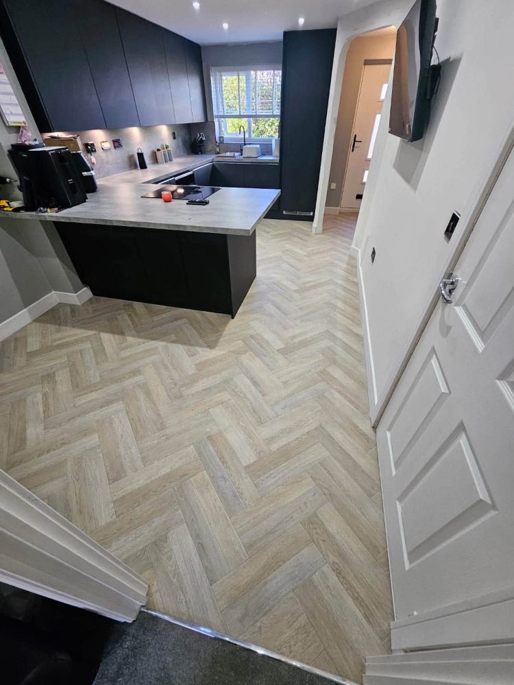 Light oak-effect herringbone vinyl kitchen flooring fitted by BDL Carpets & Vinyl, Sheffield